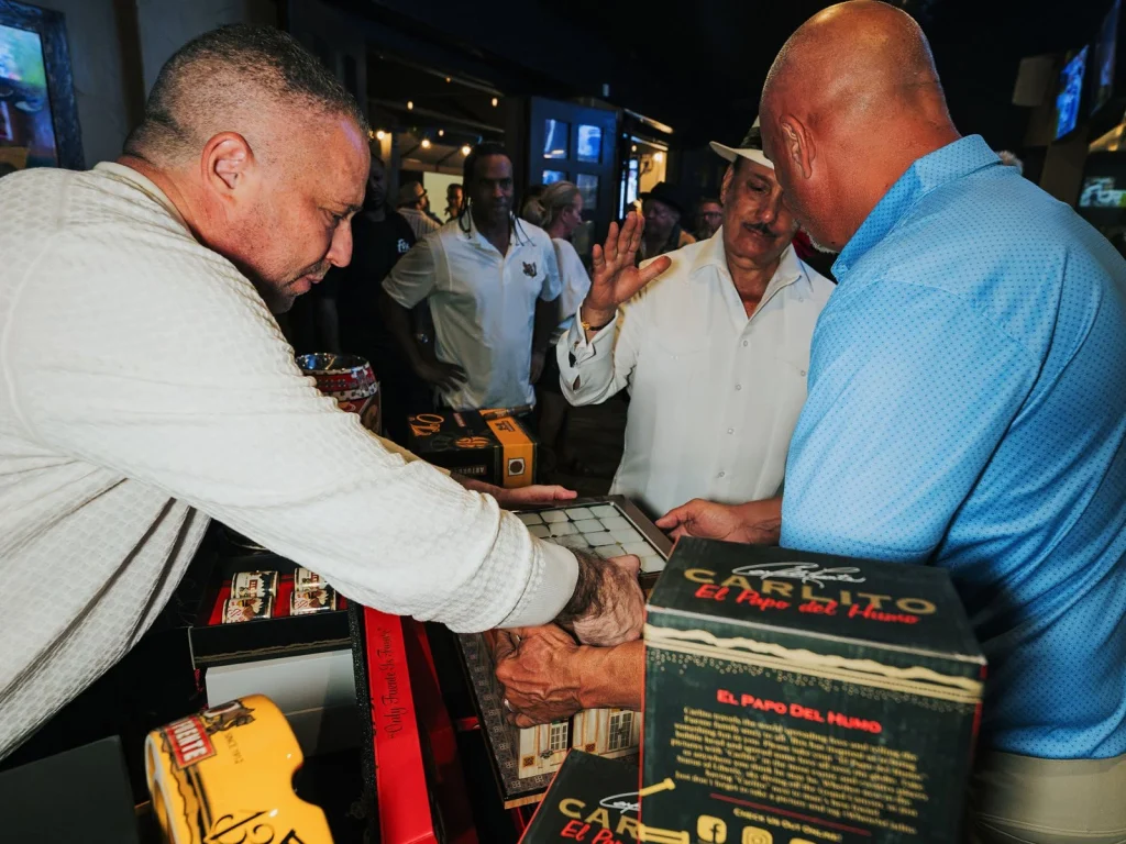 Carlito Fuente greets guests over rare Arturo Fuente cigars, Carlito boxes and collectible humidors.