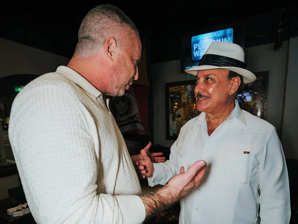 Mitchell Fox shares a moment with Carlito Fuente inside the Fox Cigar Bar Scottsdale lounge.