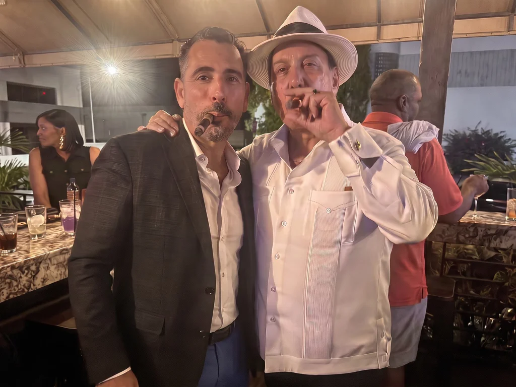 Carlito Fuente shares a cigar with Alex on the Fox Cigar Bar Scottsdale patio.