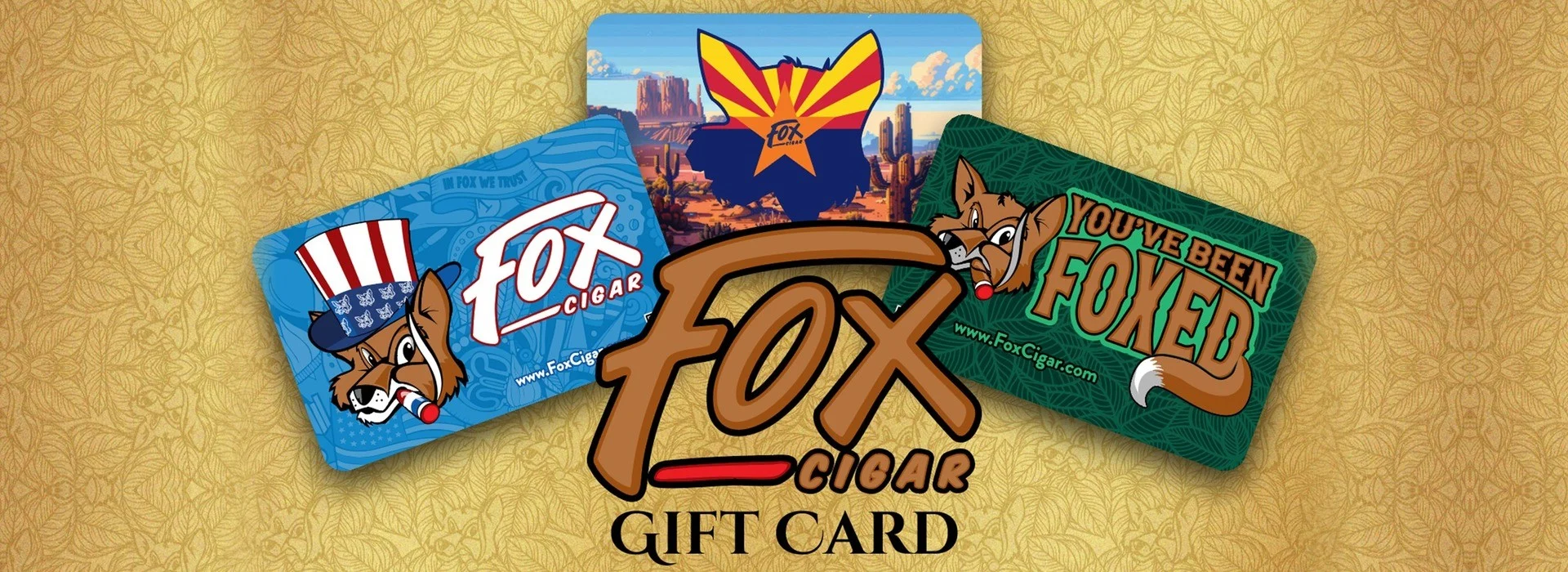 Fox Cigar gift cards: three card designs fanned behind the Fox Cigar logo on a gold leaf background